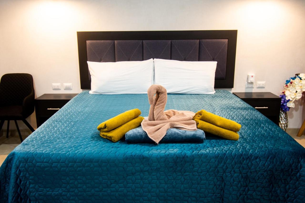 Hotel Casa Tortuga Tulum - Cenotes Park Inclusive Exteriör bild A bed with a towel swan