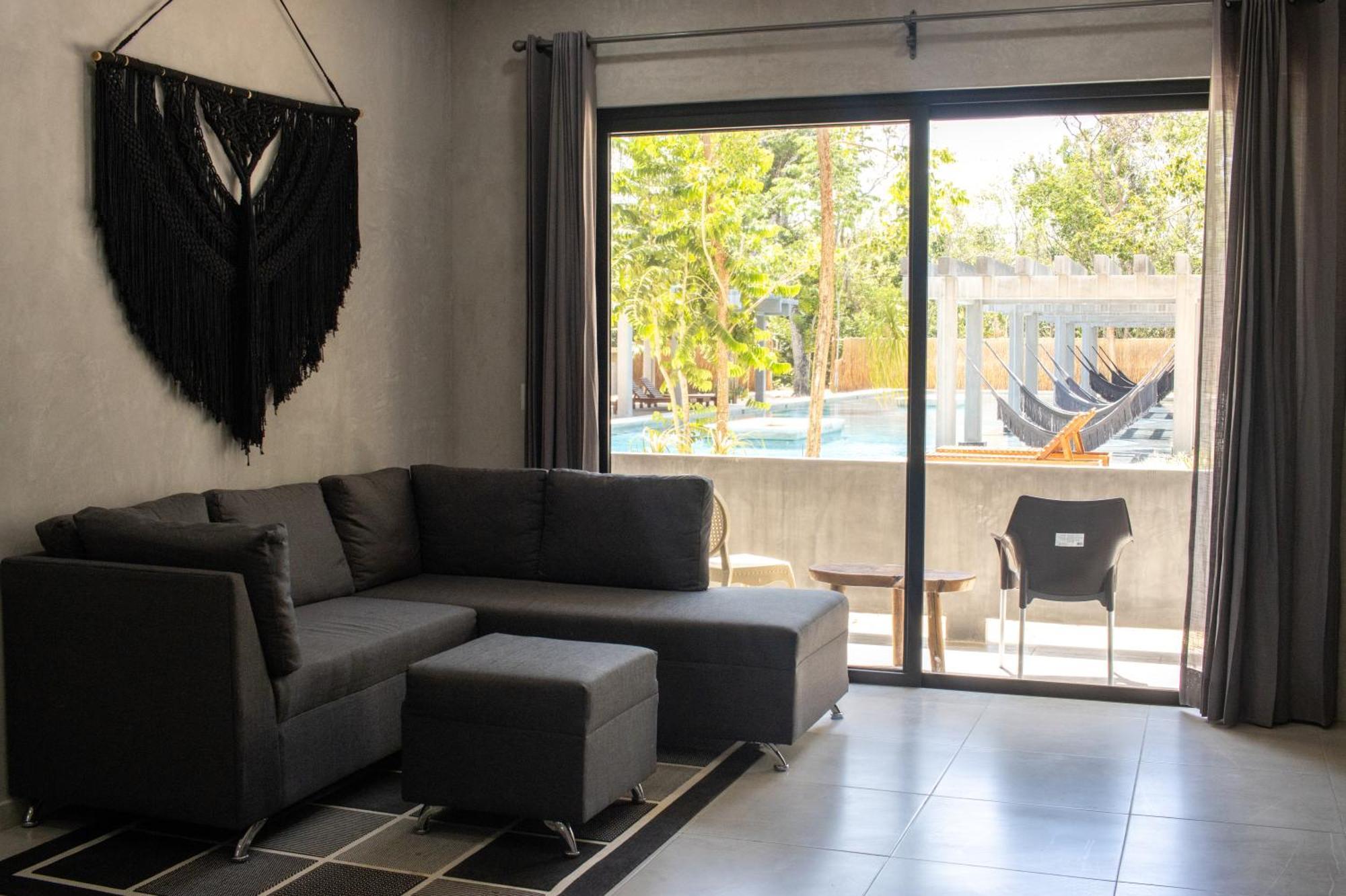 Hotel Casa Tortuga Tulum - Cenotes Park Inclusive Exteriör bild A living room with a sofa